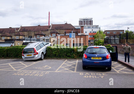 Wallington, Surrey, UK. 15th April, 2017. A car has crashed through a hedge in Shotfied carpark in Wallington, Surrey. It's unclear if the car lost control or was deliberately crashed having been stolen.  Police were in attendance.  Saturday 15 April 2017. Wallington, London Borough of Sutton. Credit: Darren Lehane/Alamy Live News Stock Photo