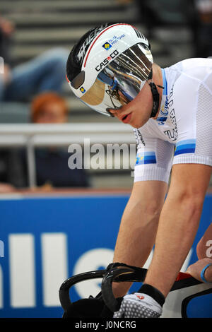 London, UK. 14th April, 2017. Martin Cechman (CZE, Dukla Brno) standing on his pedals at the start line (with Jonathan Mitchell [Billy Bisland Cycles] reflected in his visor) during the Open International Sprint semi-finals at the Southern Counties Cycling Union Good Friday Track Cycling Meet, Lee Valley Velodrome, London, UK. The Good Friday Meeting is an iconic and unique track cycling event held in the UK that has a 114 year history. As the only open entry event in British track cycling, it sees amateur and professional riders competing alongside each other on the same track. Credit: Michae Stock Photo