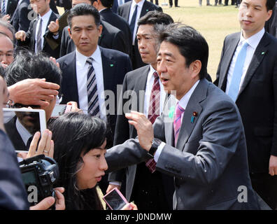 Tokyo, Japan. 15th Apr, 2017. Japanese Prime Minister Shinzo Abe shakes hands with invited guests during the cherry blossom viewing party at the Shinjuku Gyoen park in Tokyo on Saturday, April 15, 2017. More than ten thousands of invited guests enjoyed the annual garden party hosted by Abe. Credit: Yoshio Tsunoda/AFLO/Alamy Live News Stock Photo