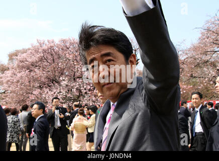 Tokyo, Japan. 15th Apr, 2017. Japanese Prime Minister Shinzo Abe reacts to invited guests during the cherry blossom viewing party at the Shinjuku Gyoen park in Tokyo on Saturday, April 15, 2017. More than ten thousands of invited guests enjoyed the annual garden party hosted by Abe. Credit: Yoshio Tsunoda/AFLO/Alamy Live News Stock Photo