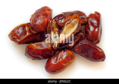 A pile of pitted dried dates on white background Stock Photo