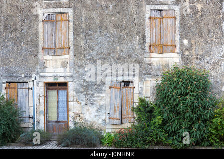 Ancient architecture and window shutters in Coulon in the Marais Poitrevin region a Grand Site de France Stock Photo