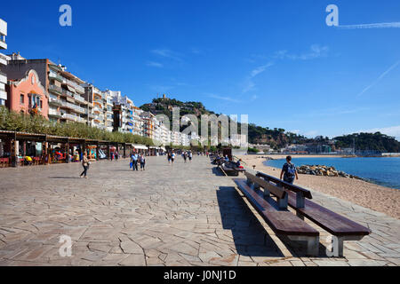 Promenade in Blanes, Spain, resort town on Costa Brava in Catalonia region, wide cobbled boulevard with restaurants, benches and apartment houses alon Stock Photo
