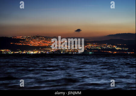 Tiberias city lights late at night on the Sea of Galilee Stock Photo