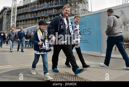 Tottenham Hotspur's fans make their way to the stadium prior to the Premier League match at White Hart Lane, London. PRESS ASSOCIATION Photo. Picture date: Saturday April 15, 2017. See PA story SOCCER Tottenham. Photo credit should read: Victoria Jones/PA Wire. RESTRICTIONS: No use with unauthorised audio, video, data, fixture lists, club/league logos or 'live' services. Online in-match use limited to 75 images, no video emulation. No use in betting, games or single club/league/player publications. Stock Photo
