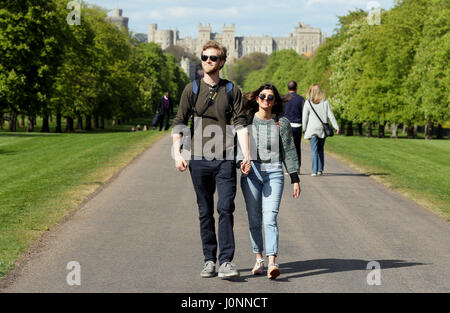 A couple stroll along the Long Walk in Windsor Great Park , Berkshire, over the Easter break. Stock Photo