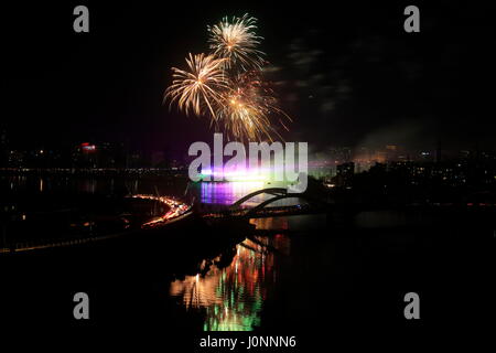 Fireworks light up the night sky during a festival of lights at Hatirjheel in Dhaka as the country reaches 15,000-megawatt power generation capacity.  Stock Photo