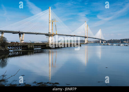 View of new Queensferry Crossing bridge under construction spanning River Forth from South Queensferry in Scotland, United Kingdom. Stock Photo