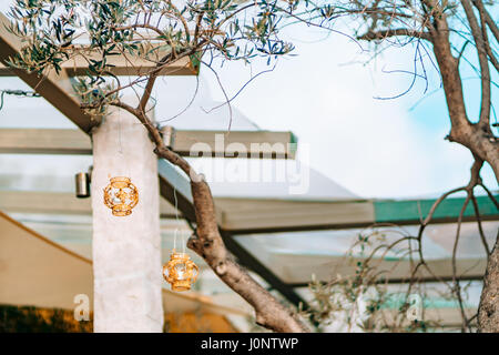 Candles in glass lamps. Wedding decorations. Wedding in Montenegro. Stock Photo