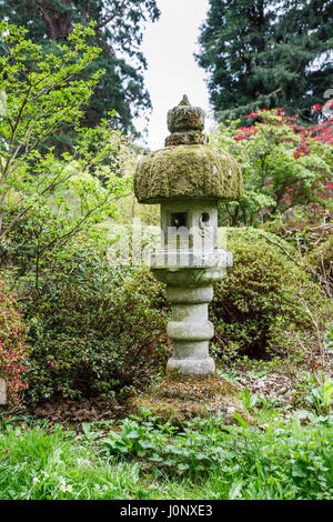 Moss-covered stone garden ornament, Ramster Garden near Chiddingfold, Surrey, south-east England, UK Stock Photo