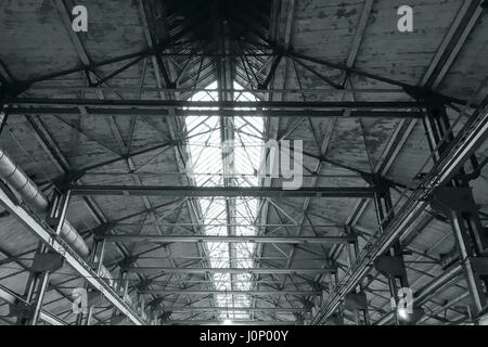 metal roof interiors structure of an old industrial building Stock Photo