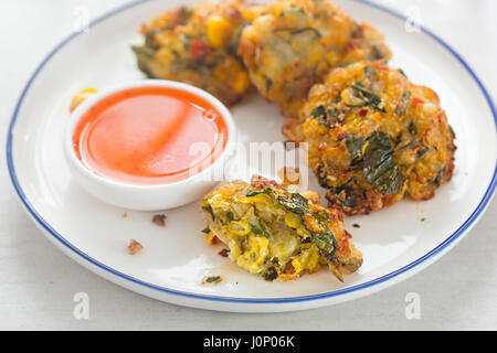 Sweet corn fritters with sweet chilli dip Stock Photo