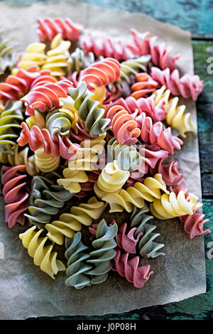 Uncooked three coloured pasta Stock Photo