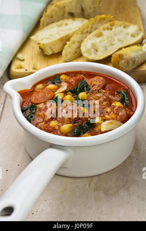 Chorizo kale chickpea soup with fresh bread Stock Photo