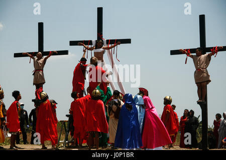 Pampanga, Philippines. 14th Apr, 2017. Hundreds of penitents walked under the midday sun in San Fernando, Pampanga, during the annual Good Friday Maleldo festival as they sacrifice their body for their faith. Flagellation and crucifixion has been discouraged by the Catholic church but devotees have continued the tradition for decades. Credit: J Gerard Seguia/Pacific Press/Alamy Live News Stock Photo