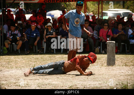 Pampanga, Philippines. 14th Apr, 2017. Hundreds of penitents walked under the midday sun in San Fernando, Pampanga, during the annual Good Friday Maleldo festival as they sacrifice their body for their faith. Flagellation and crucifixion has been discouraged by the Catholic church but devotees have continued the tradition for decades. Credit: J Gerard Seguia/Pacific Press/Alamy Live News Stock Photo