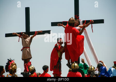 Pampanga, Philippines. 14th Apr, 2017. Hundreds of penitents walked under the midday sun in San Fernando, Pampanga, during the annual Good Friday Maleldo festival as they sacrifice their body for their faith. Flagellation and crucifixion has been discouraged by the Catholic church but devotees have continued the tradition for decades. Credit: J Gerard Seguia/Pacific Press/Alamy Live News Stock Photo