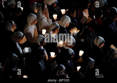 Nuns pray as Pope Francis leads the Way of the Cross (Via Crucis in Latin) celebrated at the Colosseum on Good Friday as part of the Easter Holy week celebrations in Rome, Italy. The Way of the Cross is part of the Easter tradition in Catholic countries. It takes place on Good Friday and commemorates the passion and death of Jesus Christ through the reading of prayers along a path of 14 stations. The stations all refer to different stages of Jesus' last journey to the Golgotha. In Rome, the traditional Via Crucis takes place at the ancient Colosseum amphitheater. (Photo by Giuseppe Ciccia/Pa Stock Photo