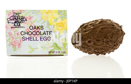 Winneconne, WI - 15 March 2017: A box of hand dipped shell egg made by Oaks chocolate located in Oshkosh, Wisconsin on an isolated background. Stock Photo