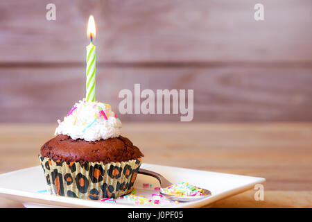 Birthday cupcake on table Stock Photo