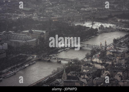 Sudden storm in spring in the French capital. View from Eiffel tower on quai d'Orsay, port des Champs-Élysées, pont des Invalides, pont Alexandre III, Stock Photo