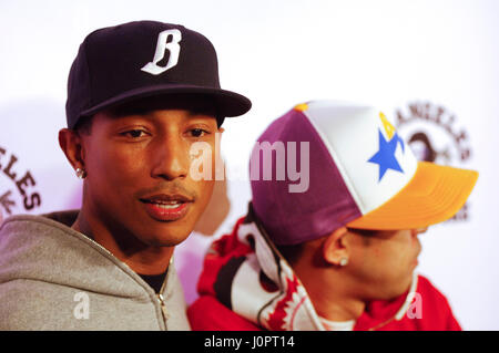 Hip-pop/R&B star Pharrell Williams of the Neptunes, right, and A Bathing  Ape producer Nigo pose for photographers at a press conference to launch  their Star Bape Search audition to look for new