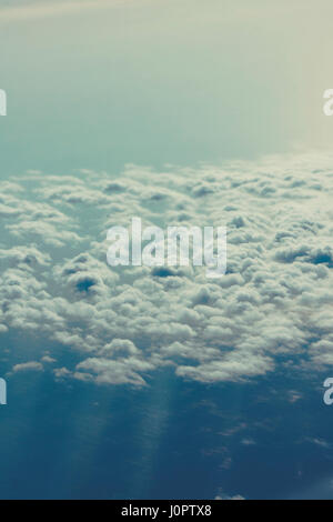 Blue sky above white fluffy cloud, cloudscape background,View from the airplane Stock Photo
