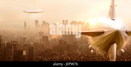 Airship over a city with sunset Stock Photo