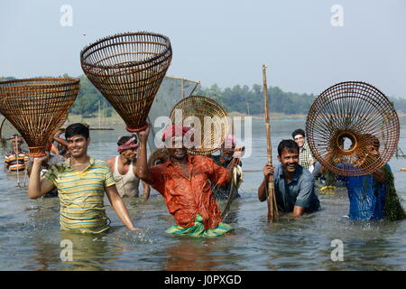 People take part in ‘Palo Bawa’, a fishing festival, at Barhaibarhi Bil in Gazipur’s Kaliakoir. Bangladesh Stock Photo