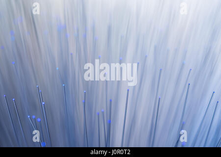 Blue lights shining on a colour changing fibre optic lamp captured up close. Stock Photo