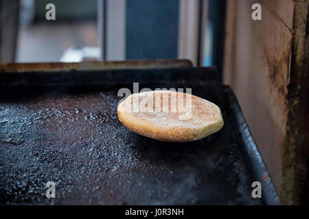 Traditional moroccan bread on grill Stock Photo