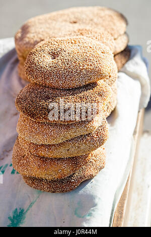 Typical traditional Moroccan flatbread with sesame seeds on street food stall, Marrakech, Morocco Stock Photo