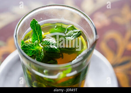 Traditional Moroccan mint tea served in Marrakesh restaurant Stock Photo