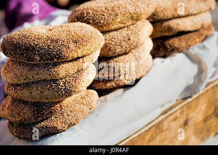 Typical traditional Sesame seeds Moroccan flatbread, on street food stall, Marrakech, Morocco Stock Photo