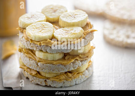 Rice cake sandwich with peanut butter and banana slices Stock Photo