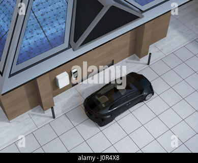 Black car charging in home EV charging station. Power supply by roof mounted solar panels. 3D rendering image. Stock Photo