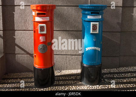 A first class (Correio Azul) and second class (Correio Normal) pillar box outside the Portugal Telecom building in Funchal, Madeira Stock Photo