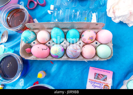 VARIETY OF DIFFERENT COLOUR EASTER EGGS AND EASTER EGG MAKING TOOLS Stock Photo
