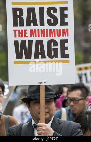 Tokyo, Japan. 15th Apr, 2017. Protester hold placards demanding a higher wage. A Group of young people by name Aequitas means Equity in Latin, organized a demonstration to demanded a minimum hourly wage of 1,500 JPY (approx. USD 13.7), currently the minimum wage ranges from 700 to 900 JPY (approx. USD from 6, 4 to 8, 3) Credit: Alessandro Di Ciommo/ZUMA Wire/Alamy Live News Stock Photo