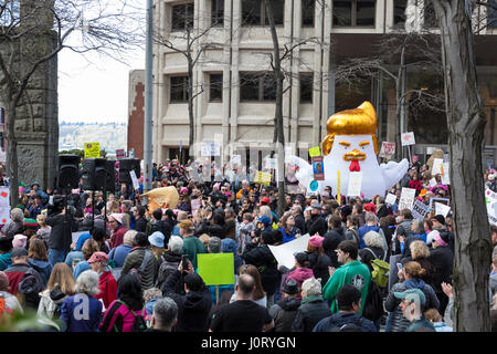 Seattle, Washington, USA. 15th April, 2017. 'Chicken Don' statue appears at the rally at the Henry M. Jackson Federal Building. Hundreds of protestors attended Tax March Seattle, a rally and sister march to the National Tax March taking place in over 180 communities across the U.S. Activists are demanding that President Trump release his tax returns and reveal his business dealings, financial ties, and any potential conflicts of interests. Credit: Paul Gordon/Alamy Live News
