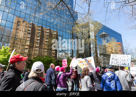 Seattle, Washington, USA. 15th April, 2017. Hundreds of protestors attended Tax March Seattle, a rally and sister march to the National Tax March taking place in over 180 communities across the U.S. Activists are demanding that President Trump release his tax returns and reveal his business dealings, financial ties, and any potential conflicts of interests. Credit: Paul Gordon/Alamy Live News