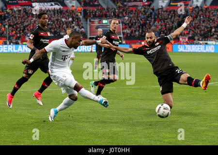 Leverkusen. 15th Apr, 2017. Douglas Costa(2nd L) of Bayern Munich shoots during the Bundesliga soccer match between Bayer 04 Leverkusen and FC Bayern Munich at BayArena Stadium in Leverkusen, Germany on April 15, 2017. The match ended with a 0-0 draw. Credit: Joachim Bywaletz/Xinhua/Alamy Live News Stock Photo