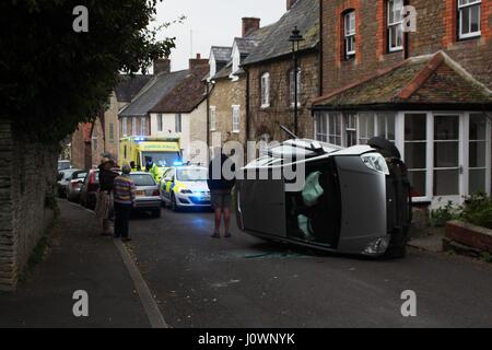 9th April, 2017. Male driver flips car on Gold Street, Stalbridge, Dorset. Stock Photo