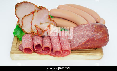 Assorted meat products including ham and sausages. Stock Photo