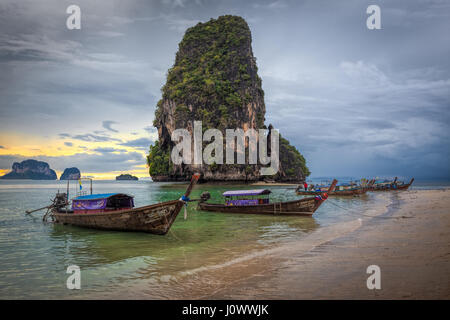 Phra Nang beach, Railay, Krabi province, Thailand: longtail boats in front of Happy Island Stock Photo