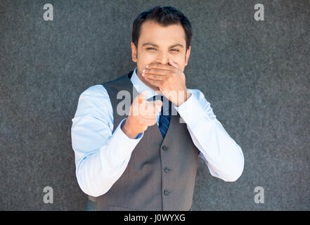 Closeup portrait of handsome excited, manager boss man in vest and tie, happy smile, pointing finger towards at you to the camera gesture, isolated gr Stock Photo