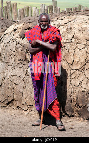Maasai elder man posing outside hut at Massai Village Ngorongoro Crater Tanzania Stock Photo