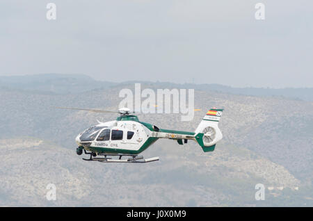 Helicopter Eurocopter EC135, (Airbus H135), of Guardia Civil of traffic (spanish security corps), is landing in Castellon de la Plana's airfield. Stock Photo