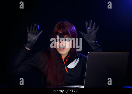 Brunette spy in black mask Stock Photo