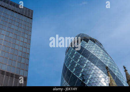 London, UK - April 3, 2016: The Gherkin skyscraper at 30 st Mary axe in the City of London on a sunny day Stock Photo